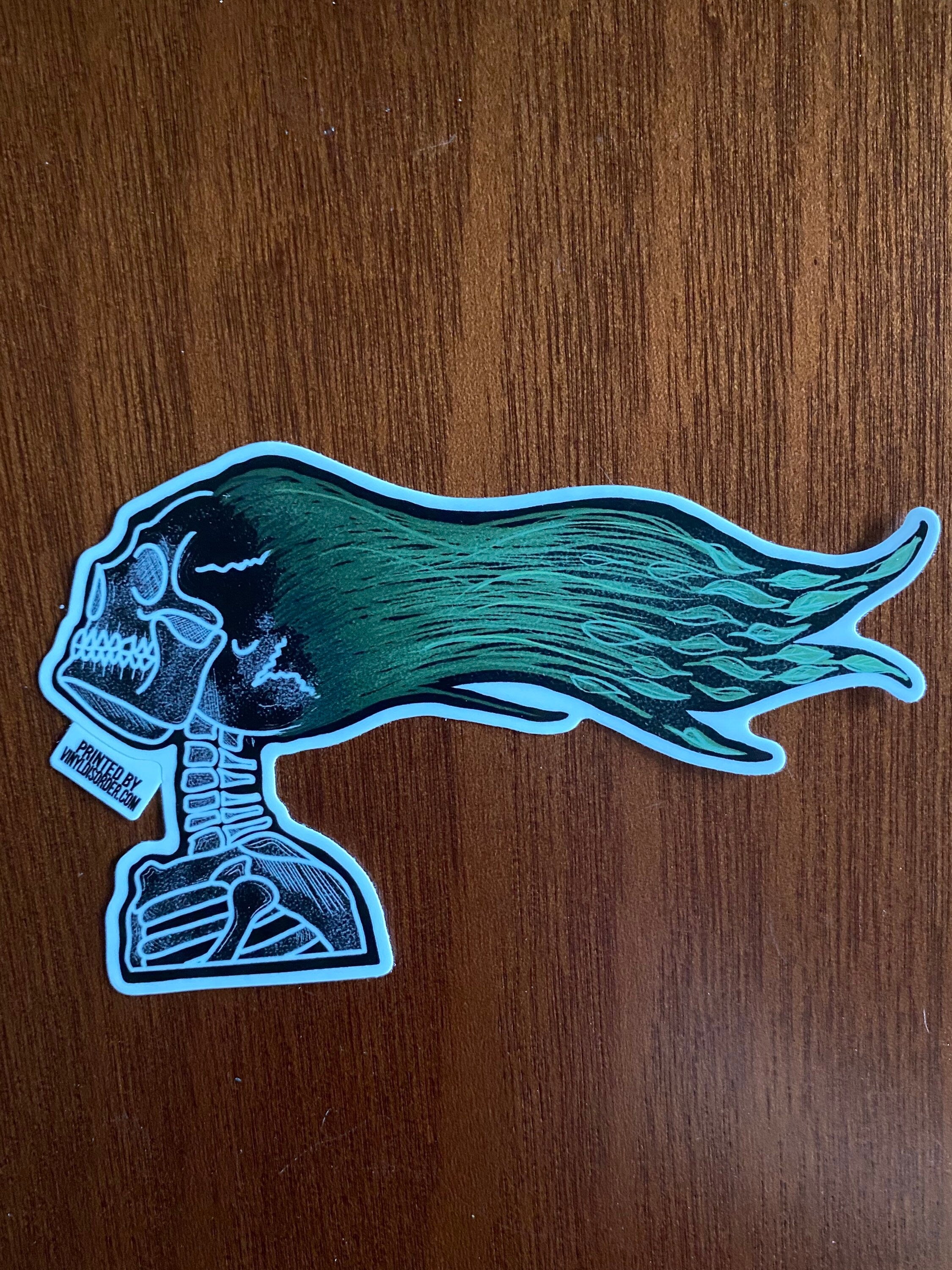 Green Haired Windblown Skull Sticker