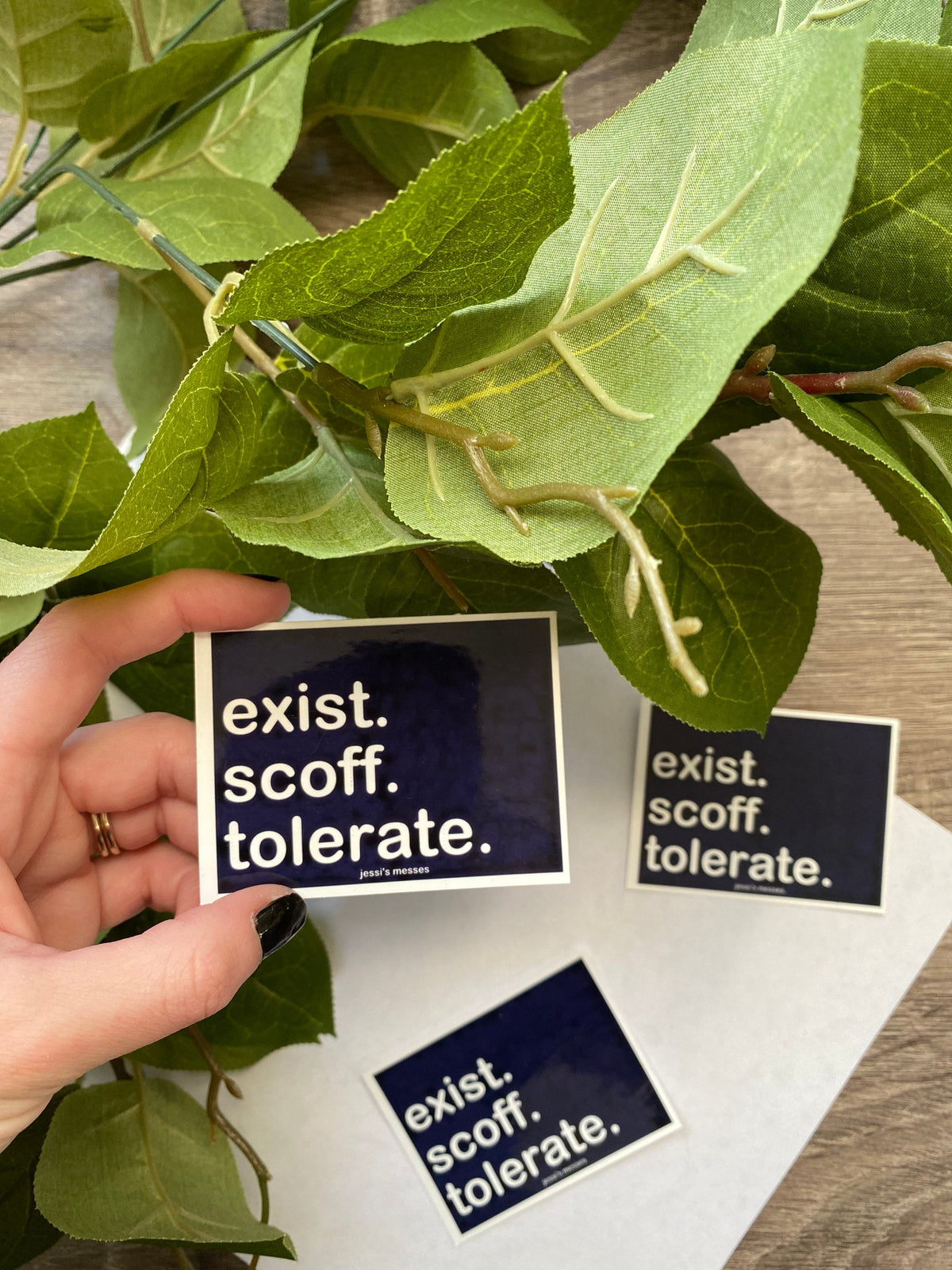 anti live laugh love, exist scoff tolerate sticker