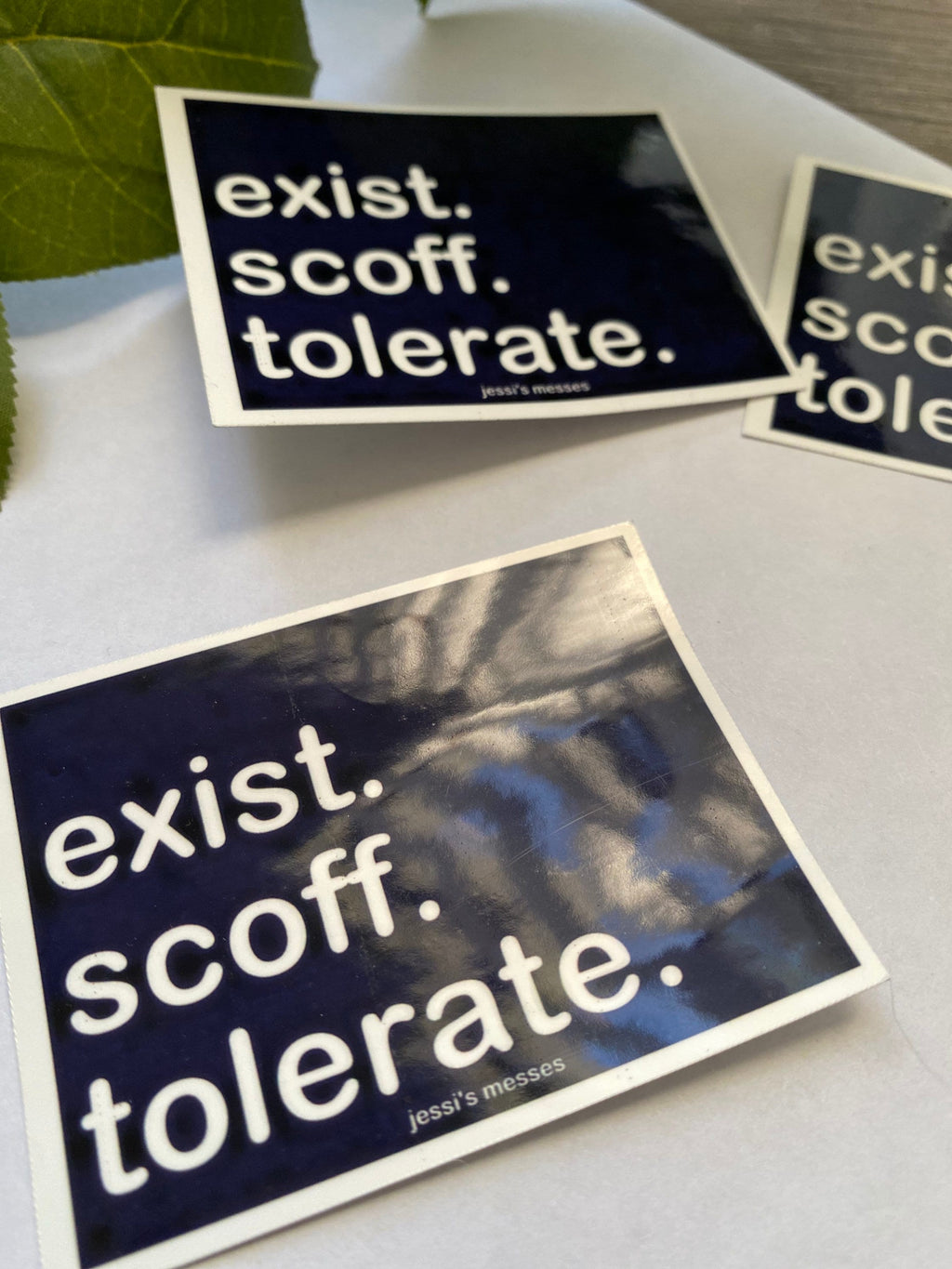 anti live laugh love, exist scoff tolerate sticker